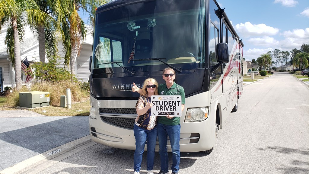 Simon and Susan with Student Driver sign.